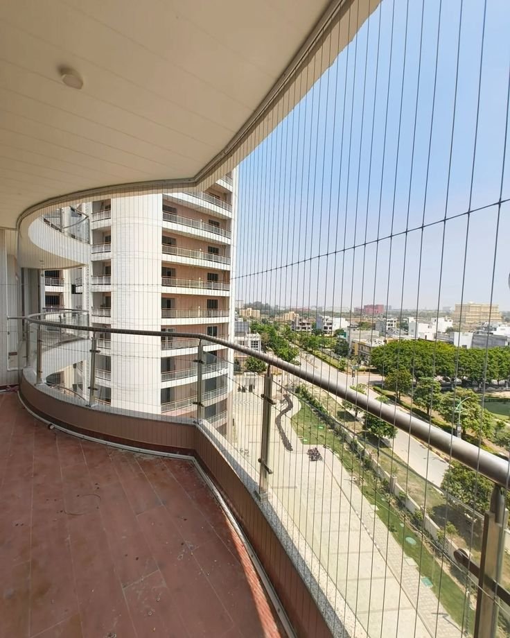 Invisible Grill installation on modern apartment balcony